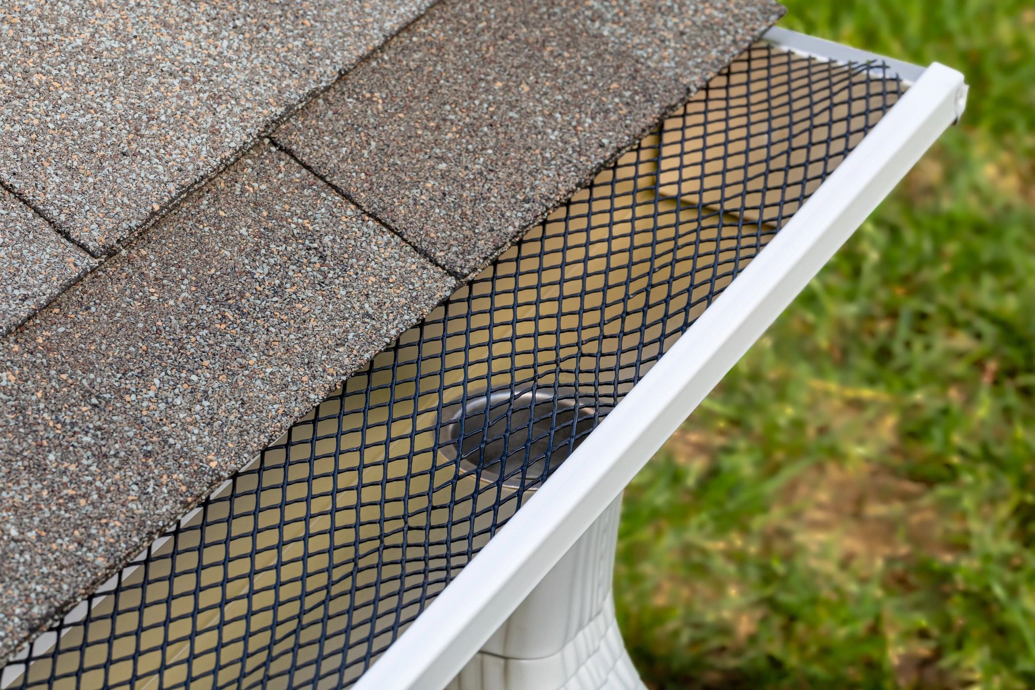Gutter guard mesh installed on seamless aluminum gutters